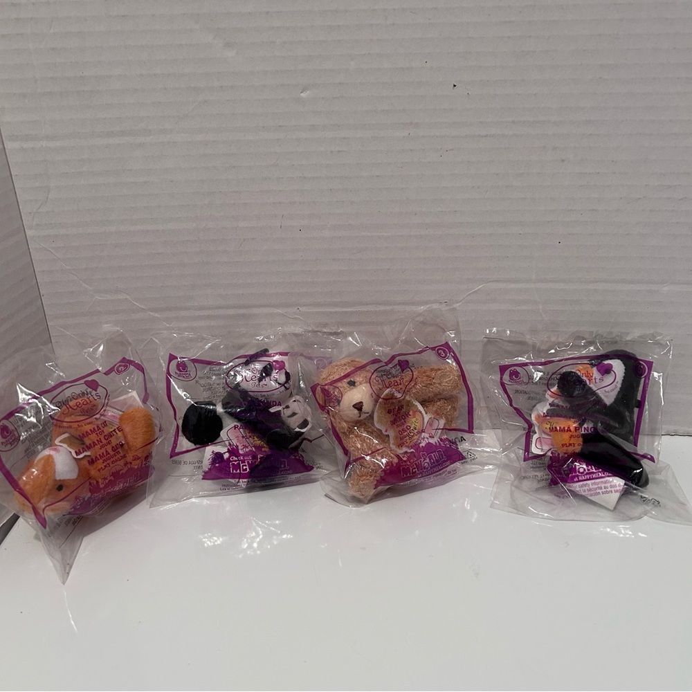 Lot of 4 McDonald Happy Meal plush toys (cat, penguin, panda and bear)